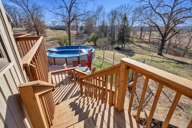 deck featuring a jacuzzi