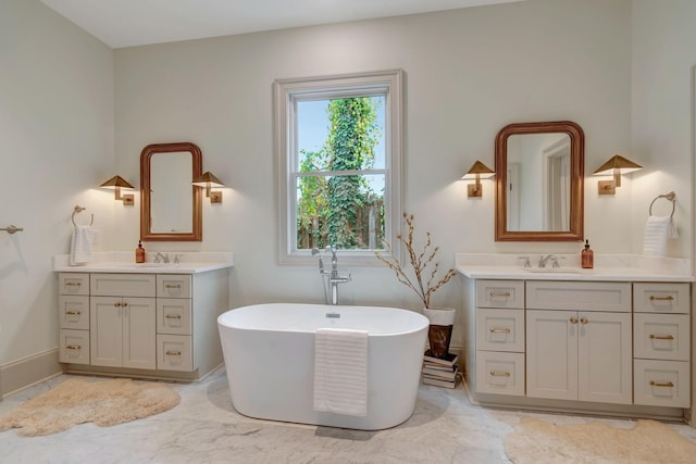 bathroom featuring vanity and a bathtub