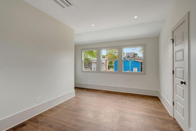 spare room featuring light wood-type flooring