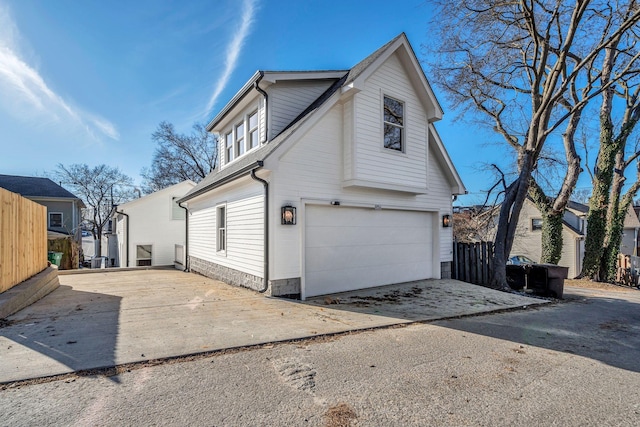 view of side of property with a garage