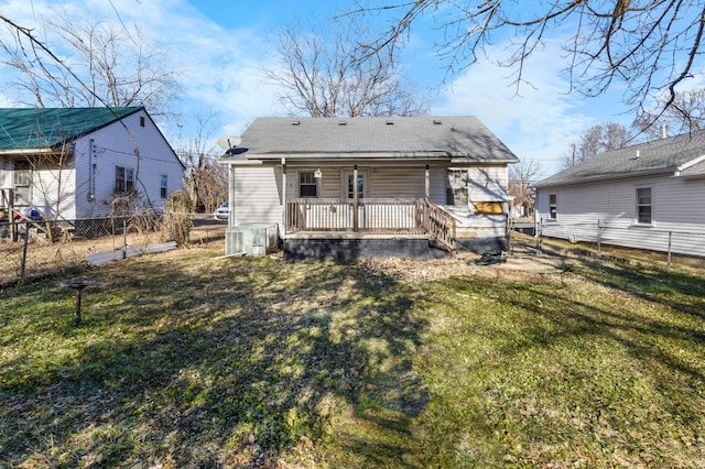 rear view of house with a lawn