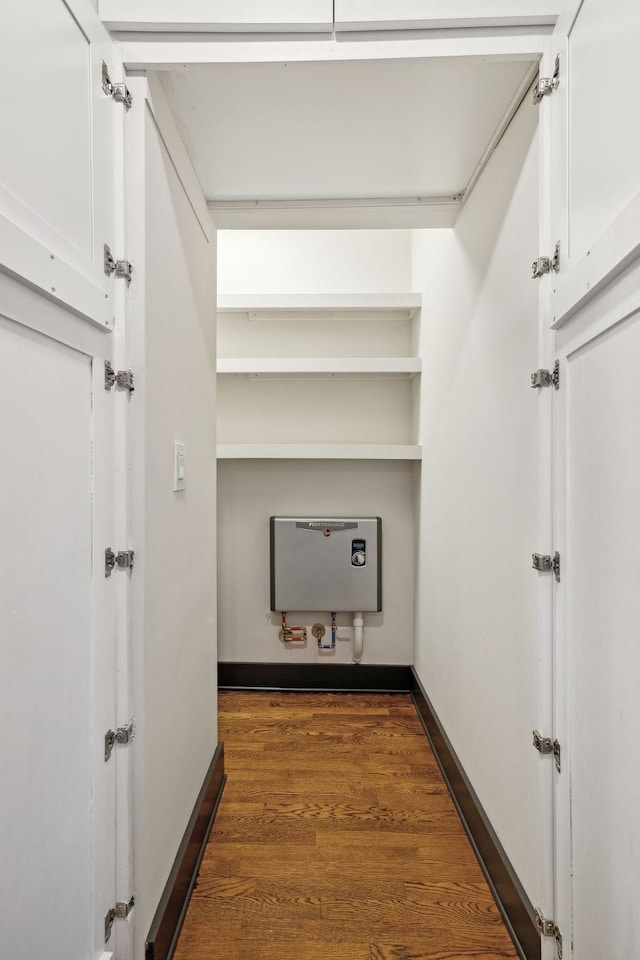 spacious closet featuring dark hardwood / wood-style floors