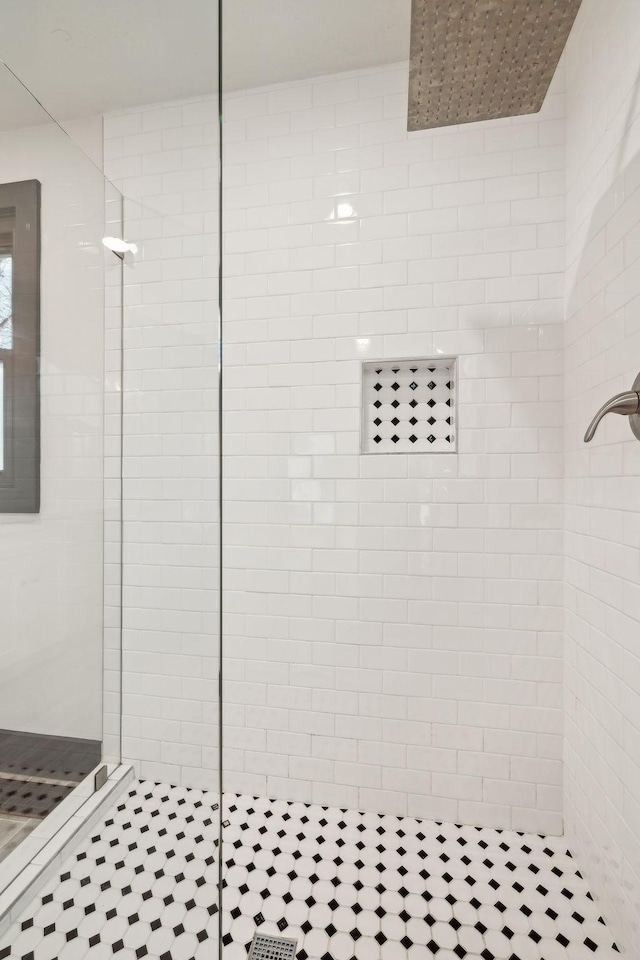 bathroom with a tile shower