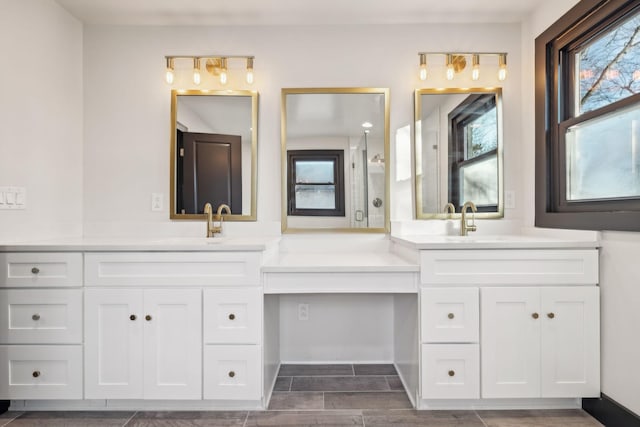 bathroom featuring vanity and a shower