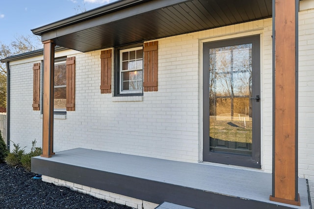 entrance to property featuring a porch