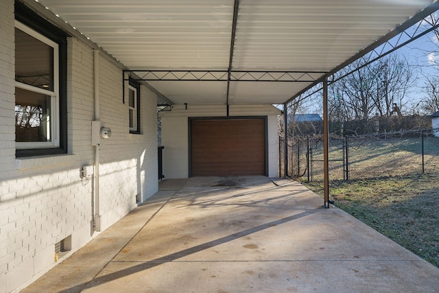 exterior space with a garage and a carport