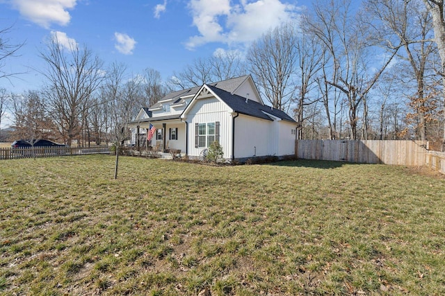 exterior space with a porch and a yard