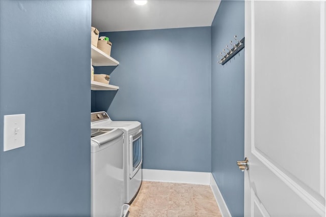 laundry room featuring washing machine and clothes dryer