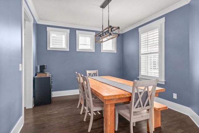 dining space with dark wood-type flooring and crown molding