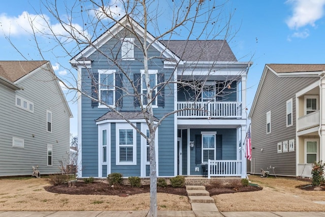 view of front of home featuring a porch and a balcony