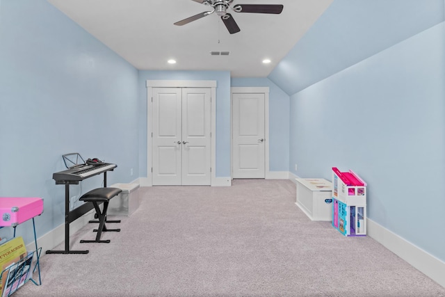 rec room featuring light carpet, ceiling fan, and lofted ceiling