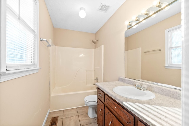 full bathroom with toilet, tile patterned flooring, washtub / shower combination, and vanity