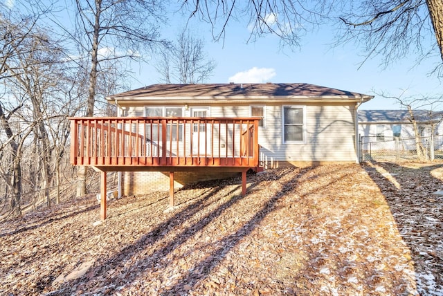 rear view of house featuring a deck