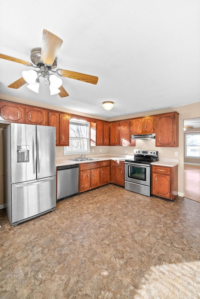 kitchen with ceiling fan, appliances with stainless steel finishes, and sink