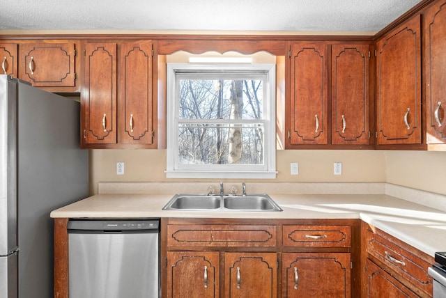 kitchen with sink and appliances with stainless steel finishes