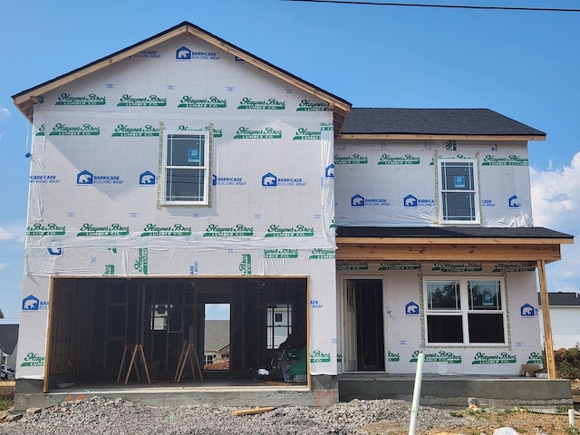 unfinished property featuring a garage