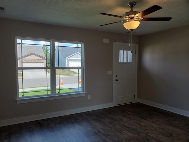 foyer featuring ceiling fan and dark hardwood / wood-style flooring