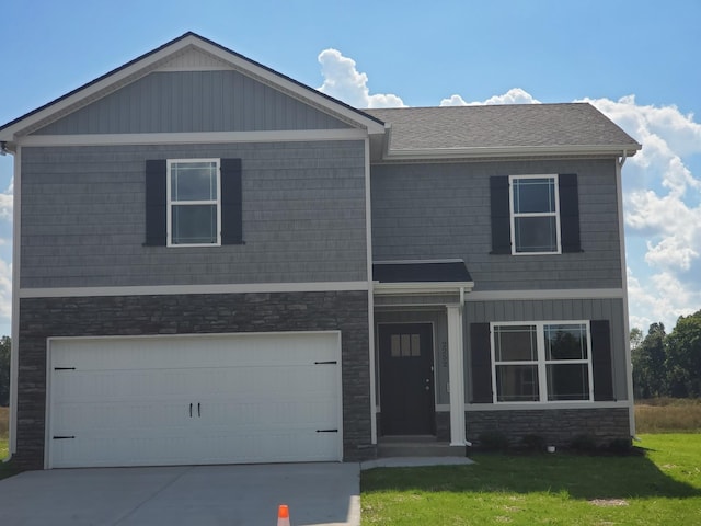 view of front facade featuring a garage and a front lawn