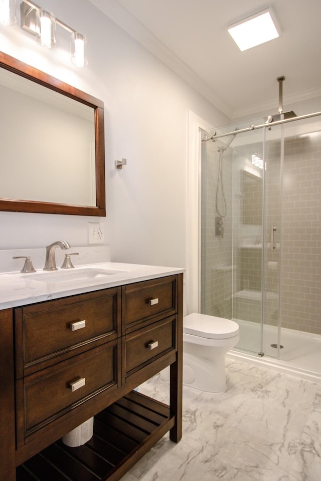 bathroom featuring vanity, toilet, crown molding, and walk in shower