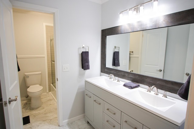 full bathroom featuring toilet, bath / shower combo with glass door, and vanity