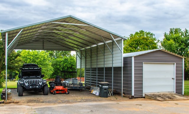 view of parking with a garage and a carport