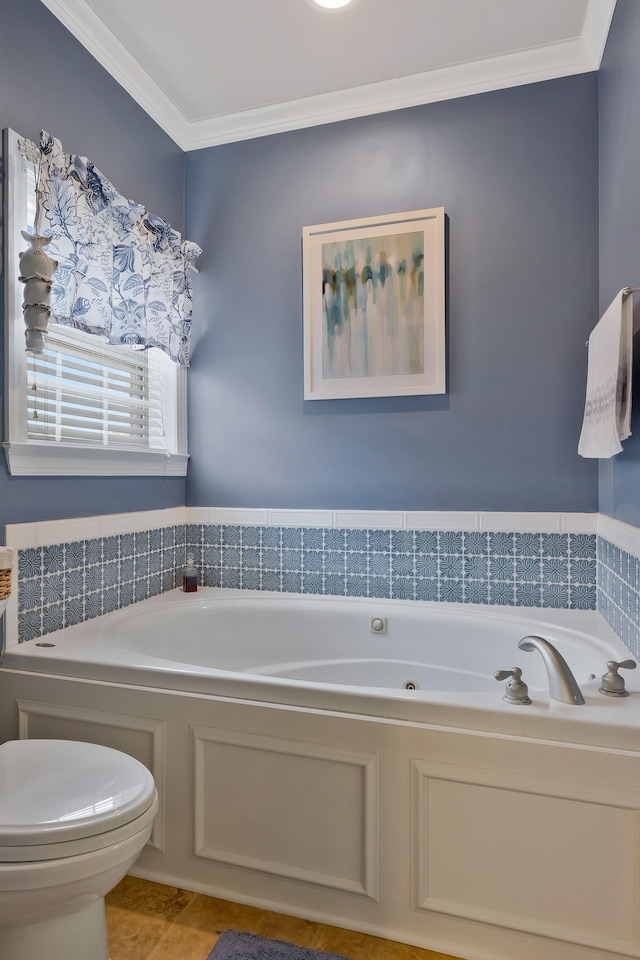 bathroom with toilet, a bathing tub, and crown molding