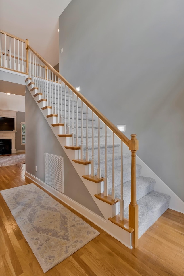 staircase with wood-type flooring