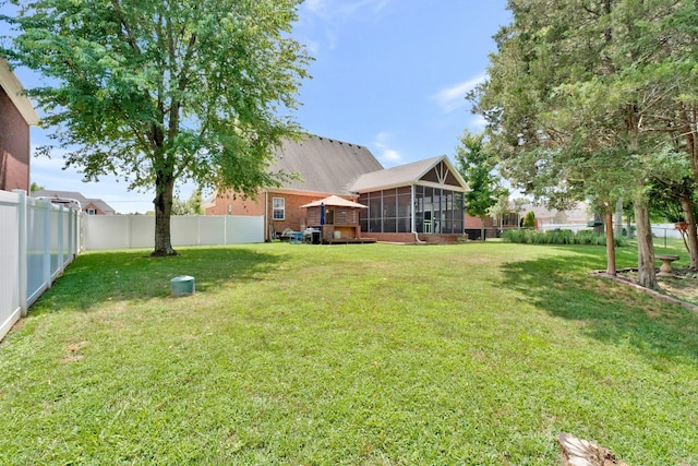 view of yard featuring a sunroom