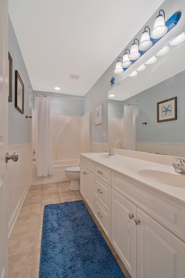 full bathroom with shower / bath combination with curtain, toilet, vanity, and tile patterned flooring