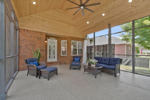 sunroom / solarium with ceiling fan, vaulted ceiling, and wooden ceiling