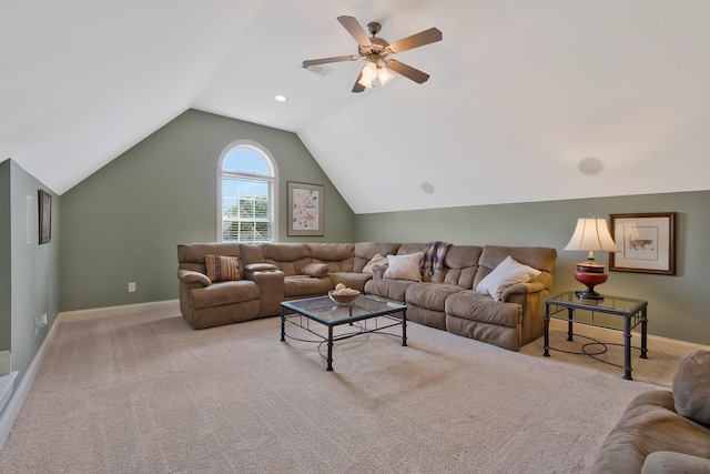 living room with ceiling fan, light colored carpet, and vaulted ceiling