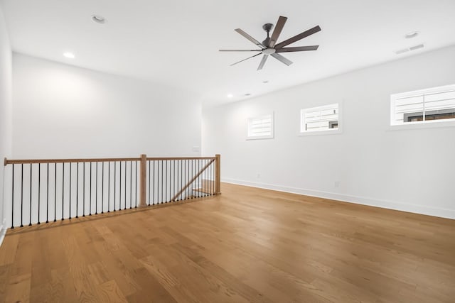 unfurnished room featuring ceiling fan and hardwood / wood-style floors