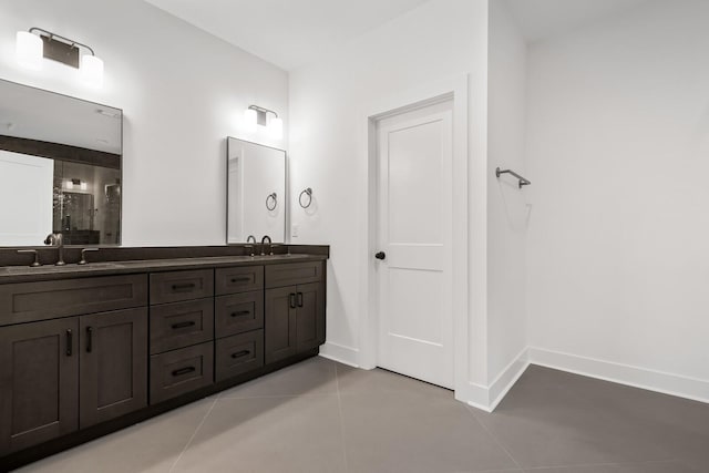 bathroom featuring walk in shower, tile patterned floors, and vanity