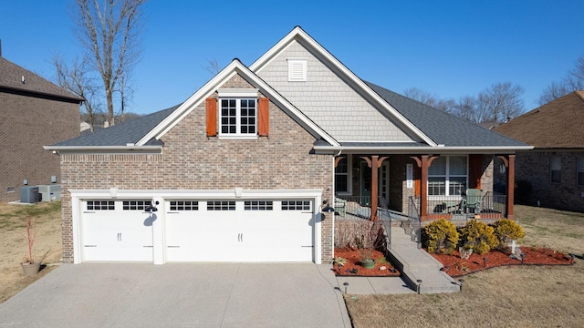 craftsman-style home with a porch, a garage, and central AC