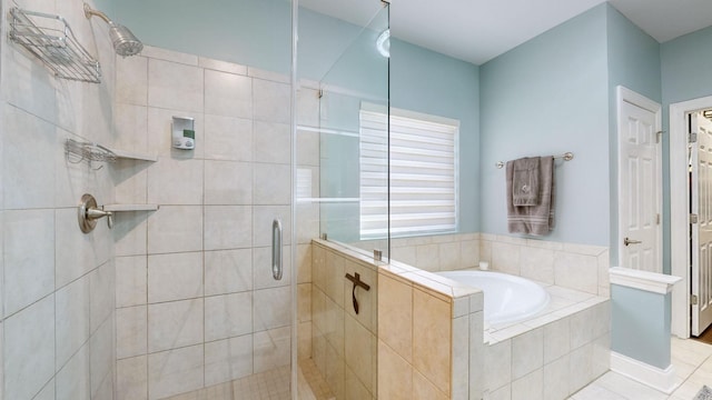 bathroom with tile patterned flooring and shower with separate bathtub