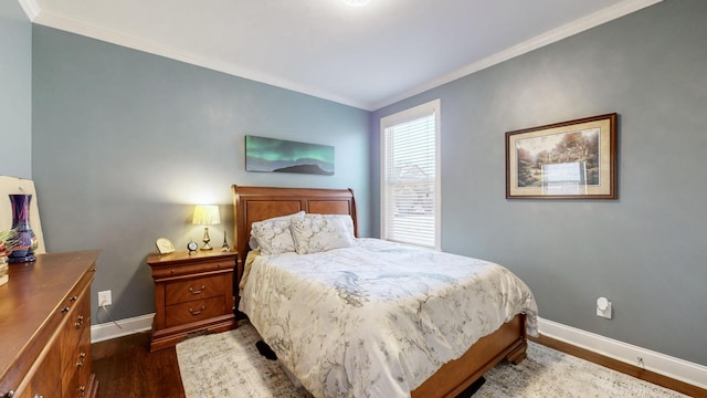 bedroom featuring ornamental molding and dark hardwood / wood-style floors