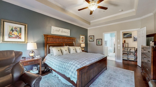 bedroom featuring ceiling fan, ornamental molding, dark hardwood / wood-style floors, and a raised ceiling