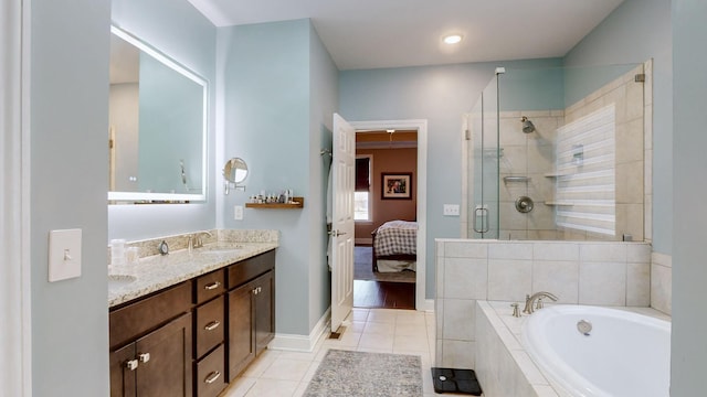 bathroom with vanity, tile patterned floors, and separate shower and tub