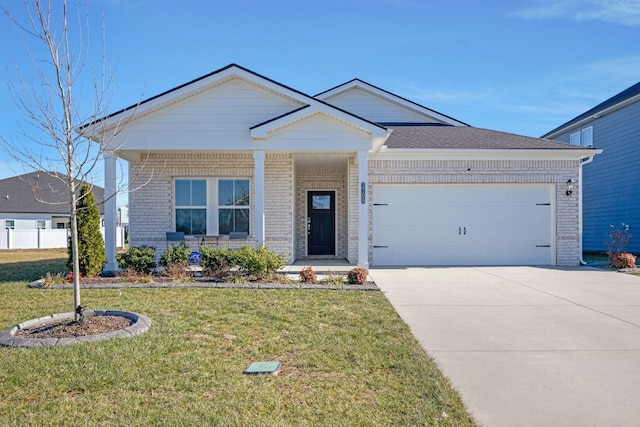 view of front of property featuring a garage and a front lawn