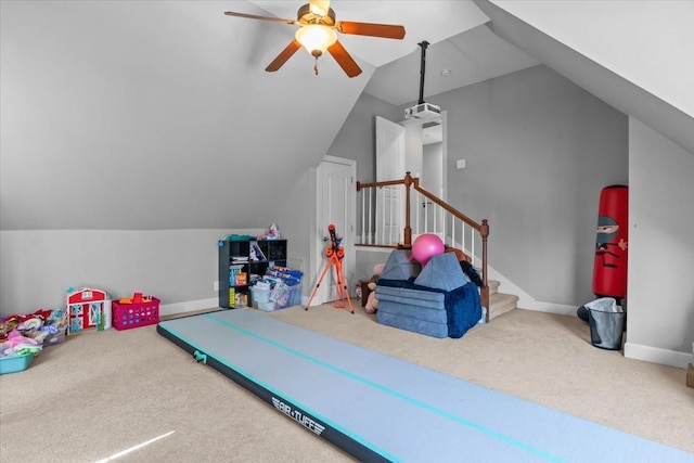 rec room featuring lofted ceiling, ceiling fan, and carpet flooring