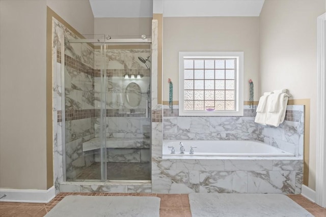 bathroom featuring tile patterned flooring and plus walk in shower