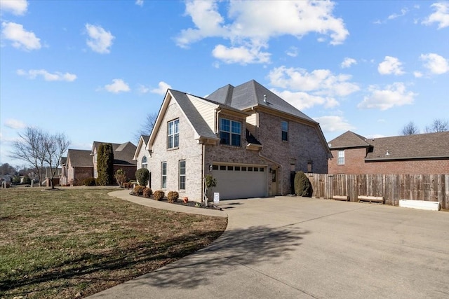 view of side of property with a garage and a lawn