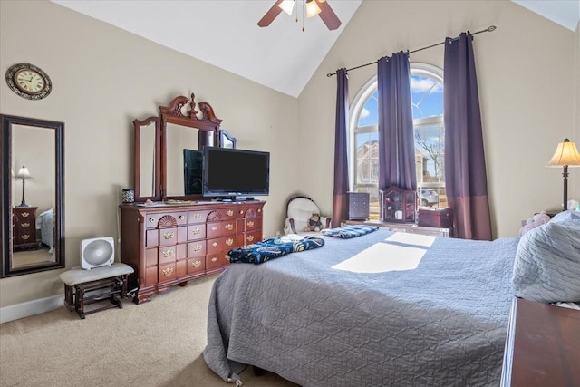 bedroom with ceiling fan, lofted ceiling, and carpet flooring