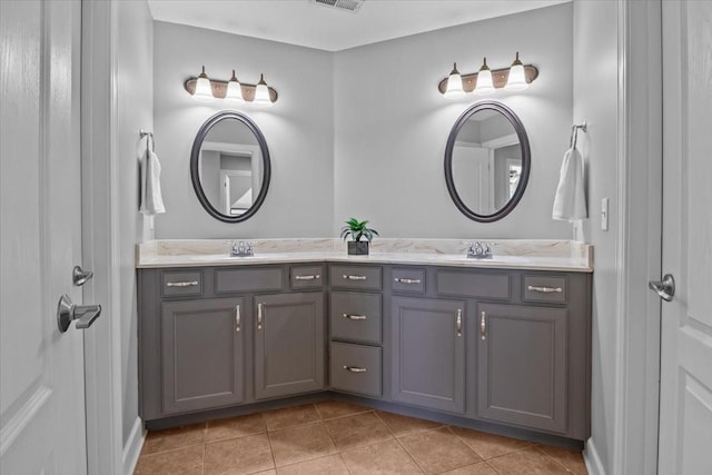 bathroom with vanity and tile patterned flooring