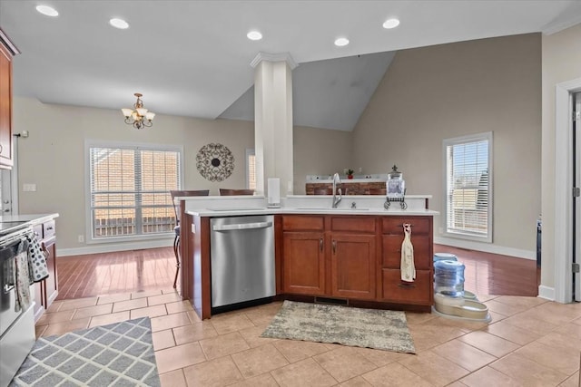 kitchen featuring an inviting chandelier, sink, plenty of natural light, and dishwasher