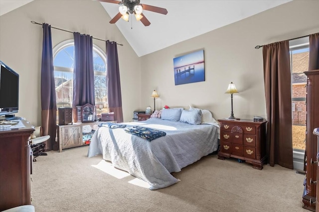 bedroom featuring ceiling fan, light colored carpet, and high vaulted ceiling