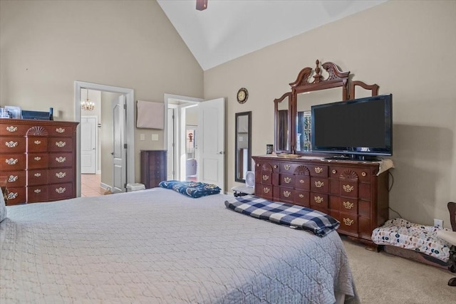 bedroom with light carpet, ceiling fan with notable chandelier, and high vaulted ceiling