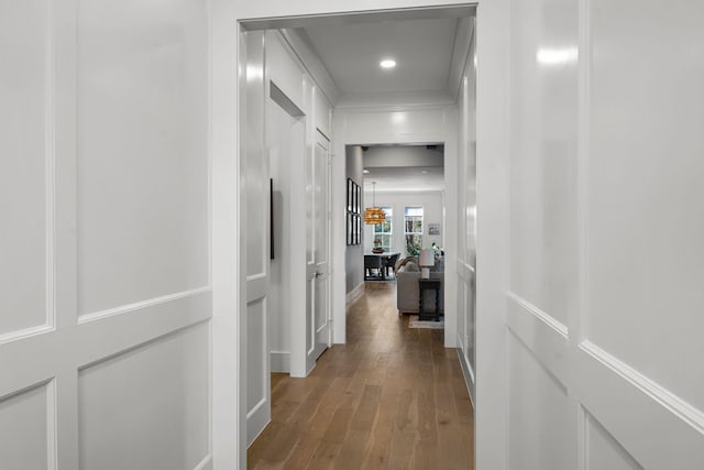 corridor with wood-type flooring