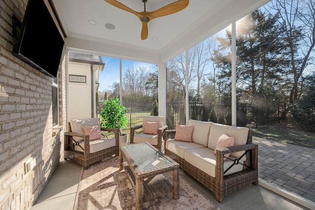 sunroom featuring ceiling fan