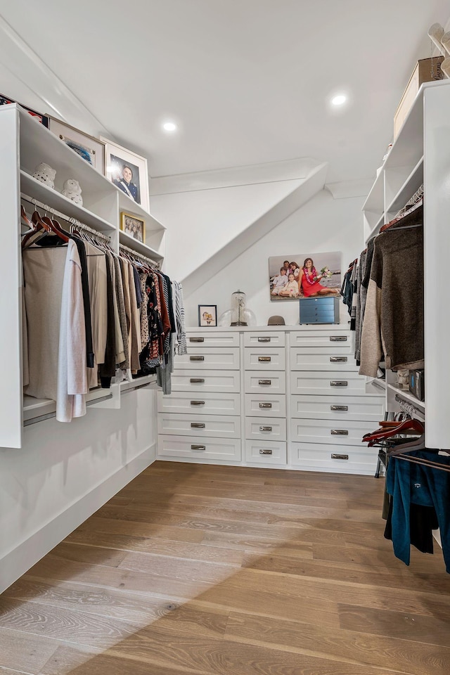 walk in closet featuring light hardwood / wood-style flooring